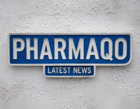 a white textured background with a blue and white heading pharmaqo and latest news